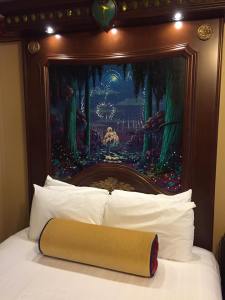 Bed in our guest room--the headboard has a button you push that starts a fiber optics fireworks show!